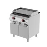 Grille à pierre lavique à gaz sur meuble avec porte battante